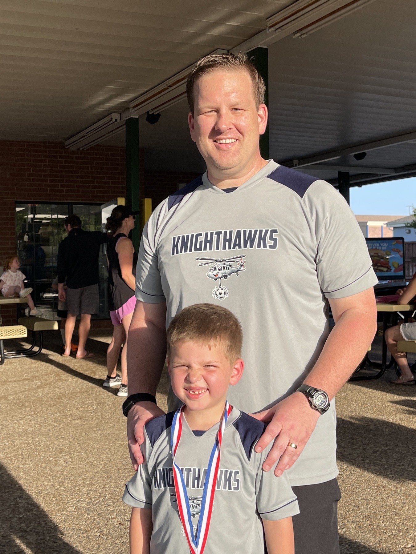 Jeremy Hans with his son after a soccer game